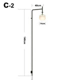 Minimalistische Wandleuchte mit langem Mast: Trendige Beleuchtungslösung
